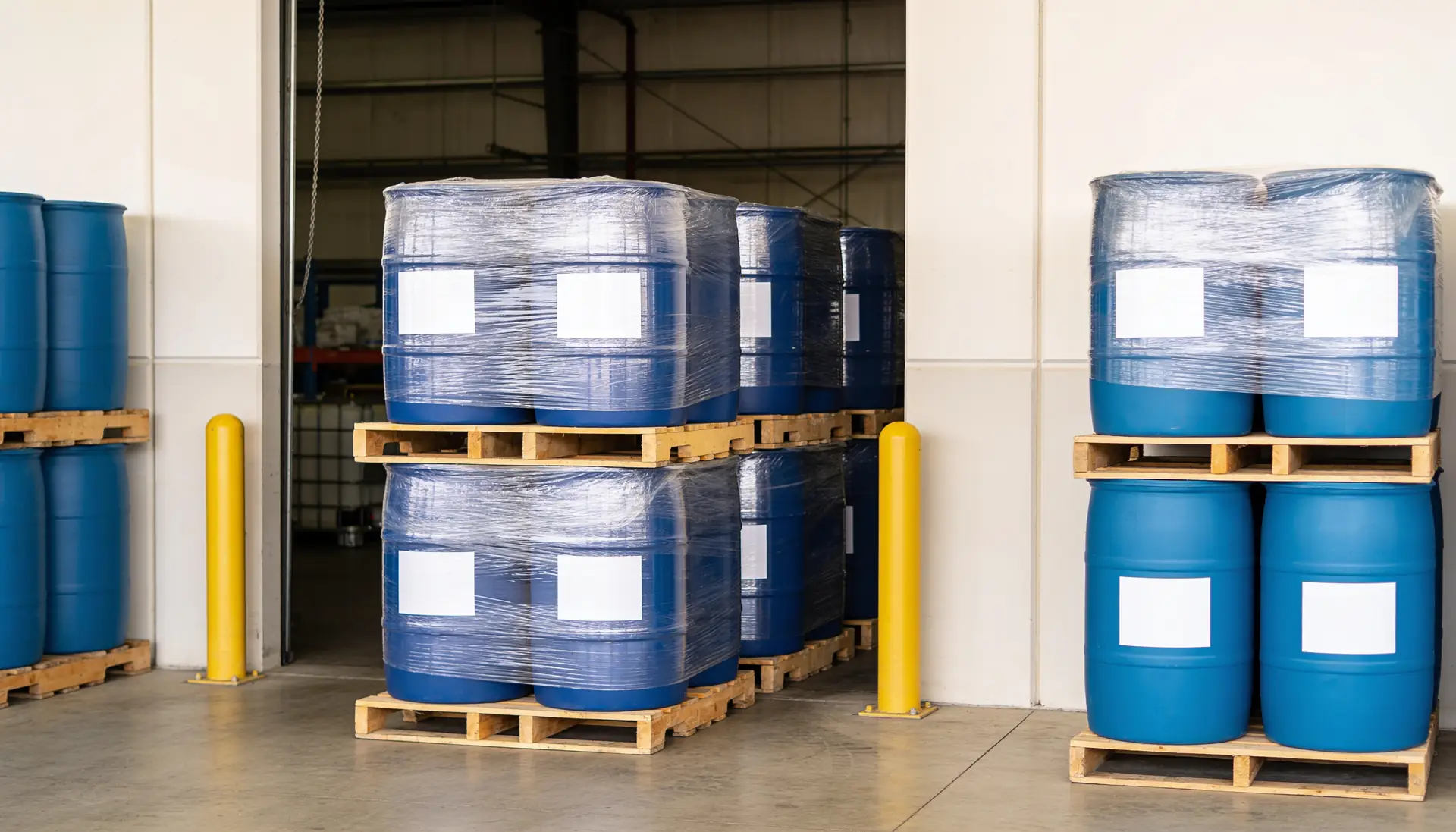 Sealed blue drums on pallets, ready to ship